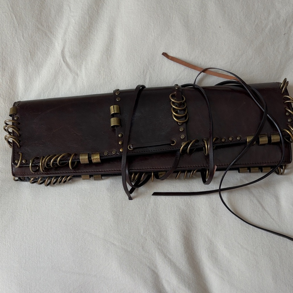 YSL PIERCED  Leather Clutch with Brass Accents